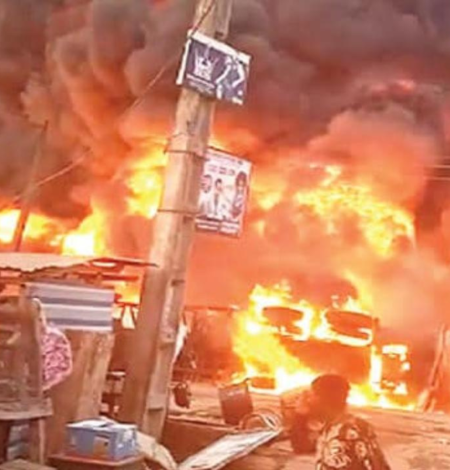 Riots break out amongst thugs in Lagos, setting a market on fire.